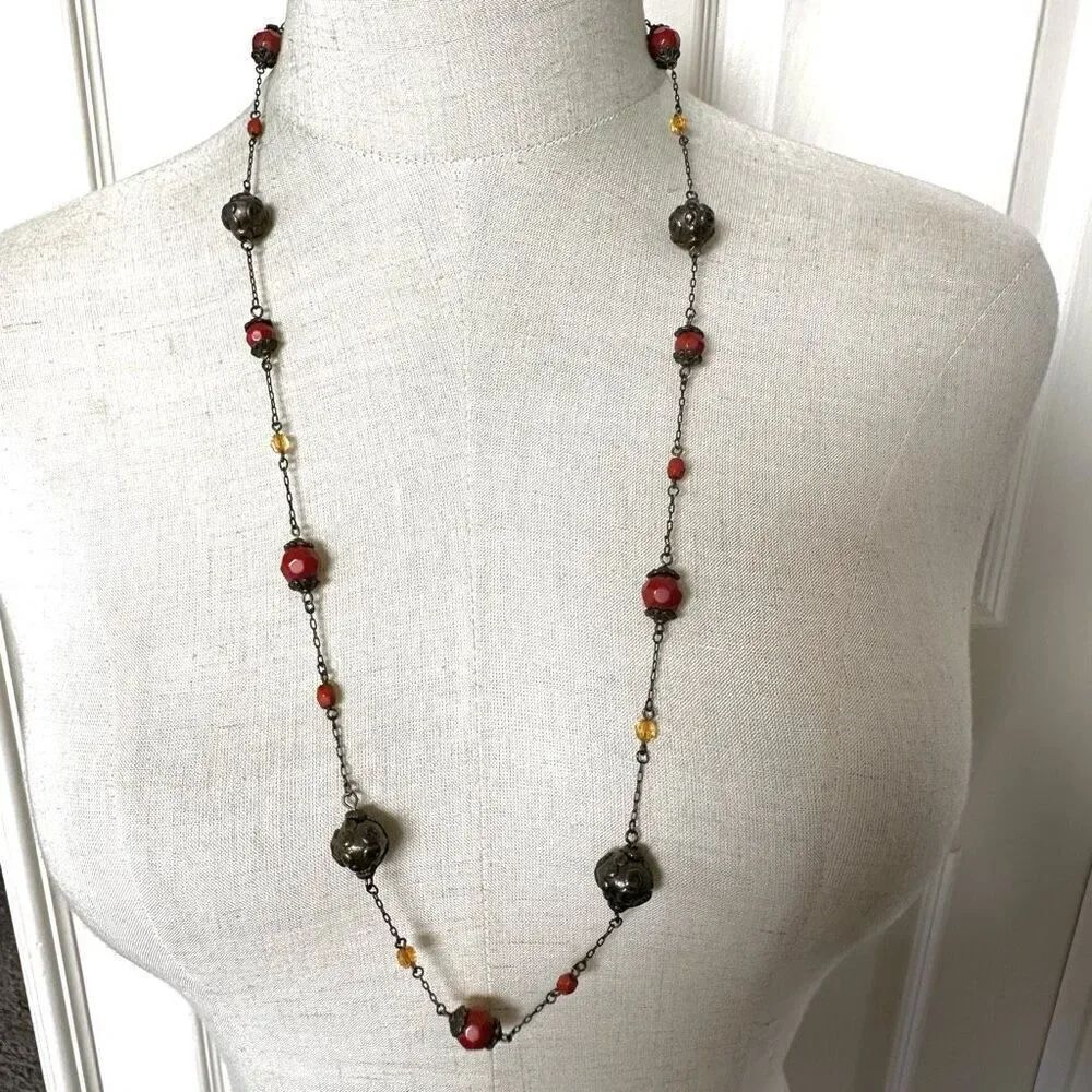 Orange and brass tone beaded long necklace